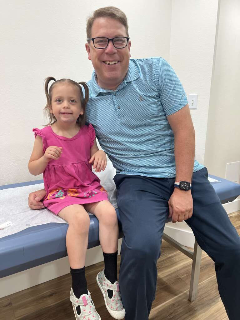 Dr Blake with a young child patient