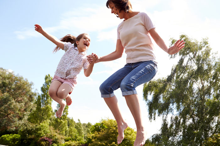 MomDaughterJumping Mom happy to be able to play with her daughter without worrying about bladder leaks